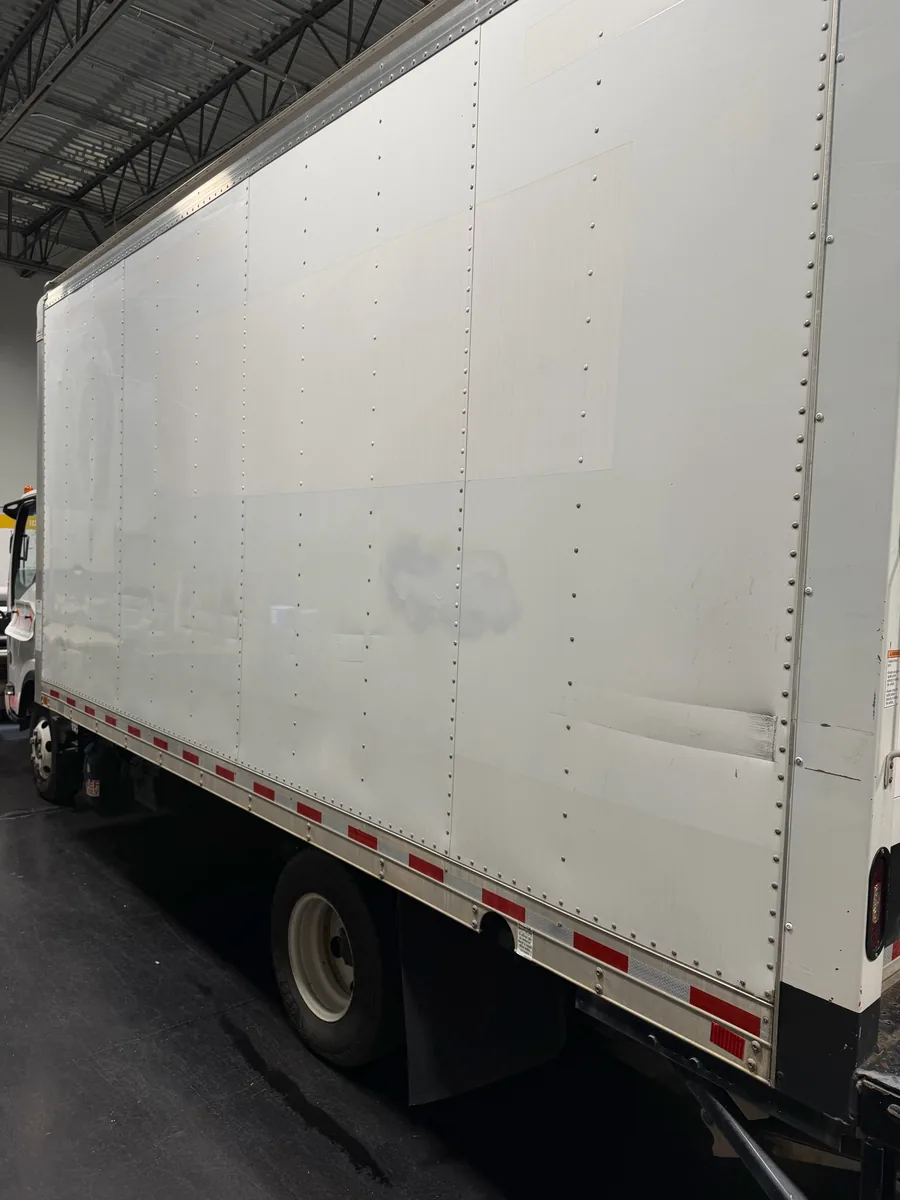 Plain white box truck before its graphics