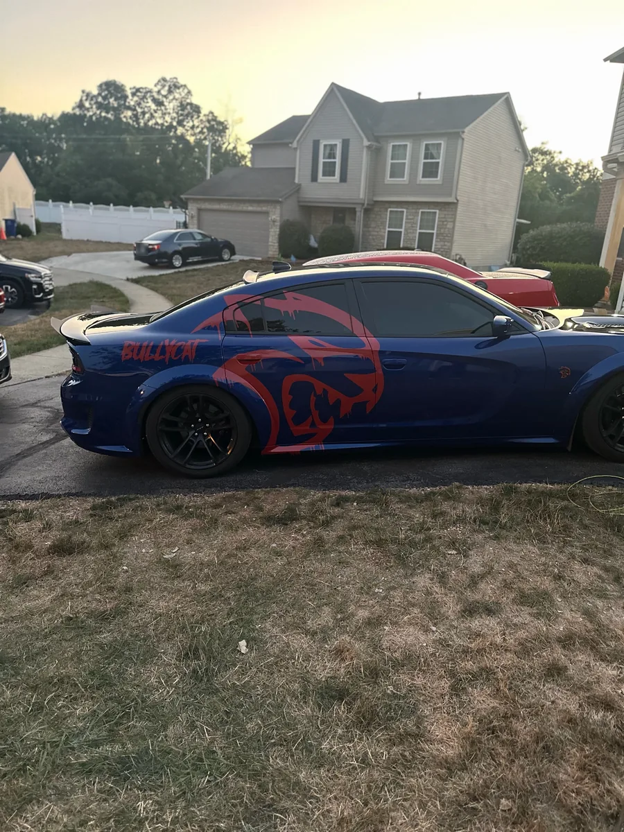 Blue widebody Dodge Charger with a red graphic