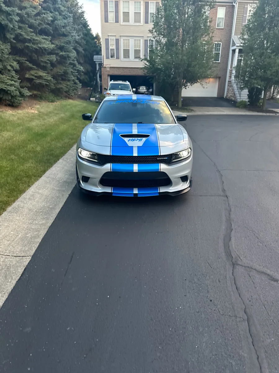 Silver Dodge Charger with blue racing stripes