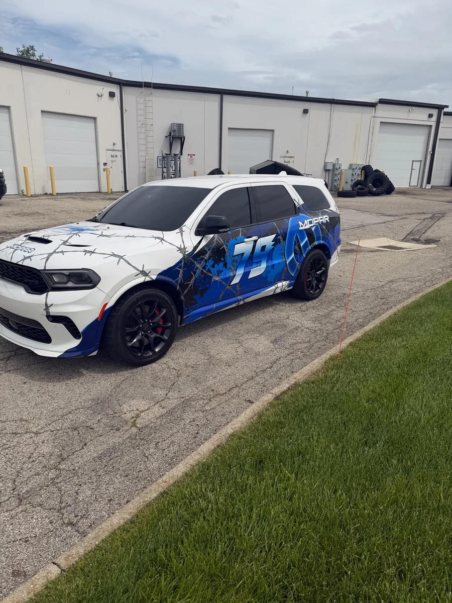 Dodge Durango with blue and white branded graphics