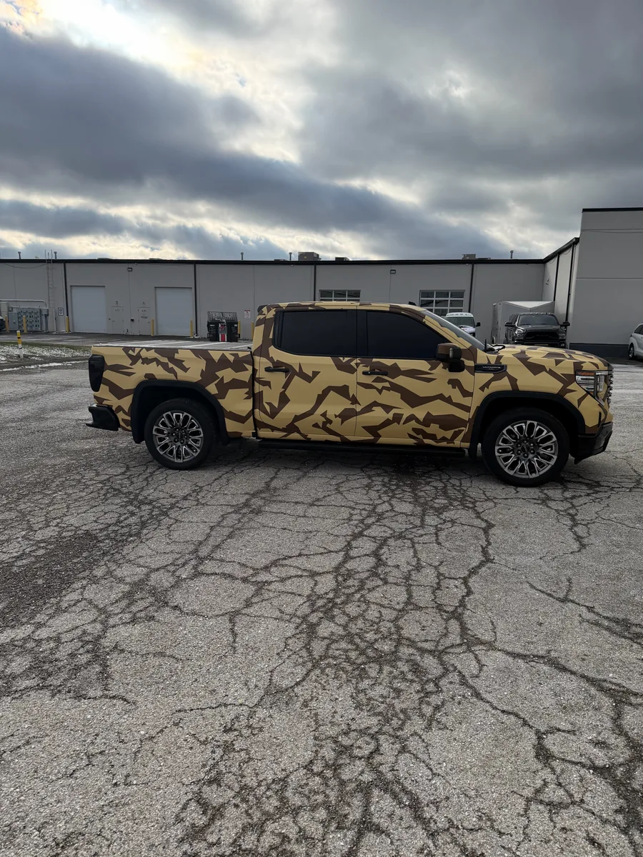 GMC Sierra pickup after a printed camo wrap