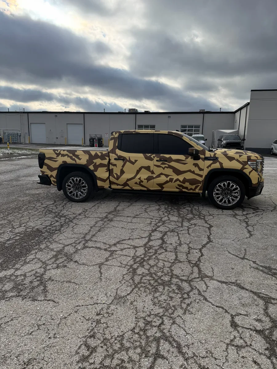 After: Porsche Panamera in a green color change (desktop) or GMC Sierra in a printed camo wrap (mobile)