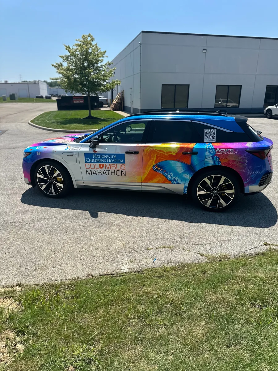 Crossover SUV in a multicolor custom print wrap