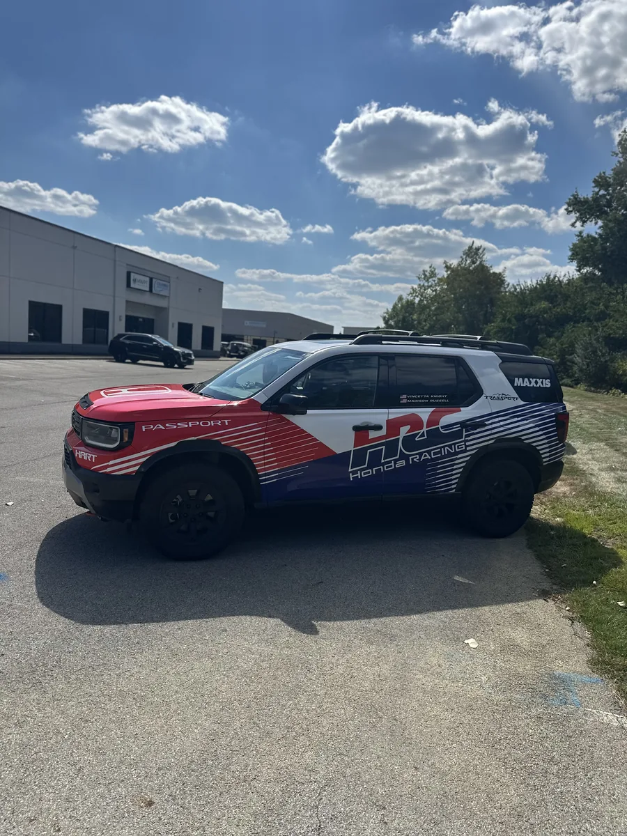 SUV with red, white, and blue branded graphics