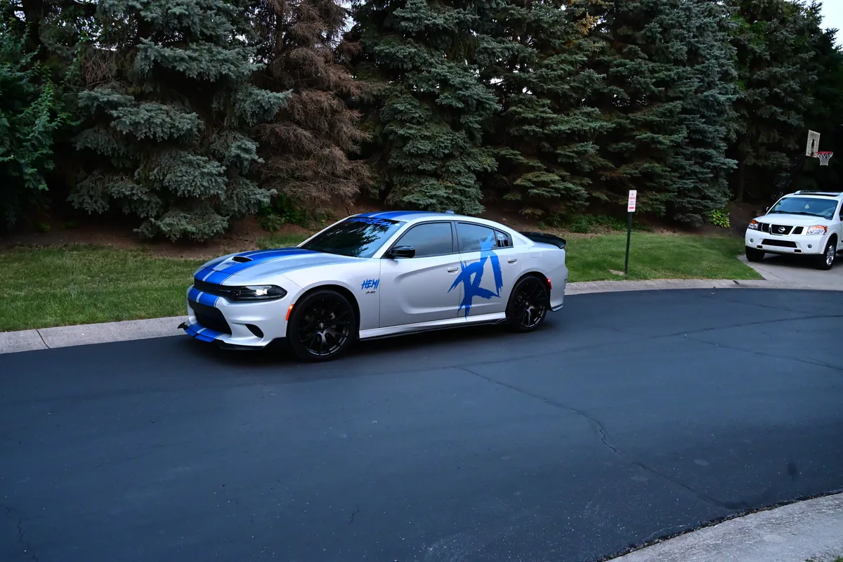 White Dodge Charger with blue racing stripes