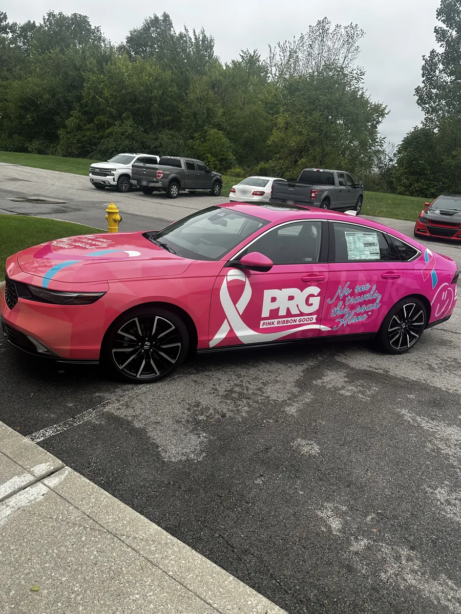 Sedan with pink ribbon branding