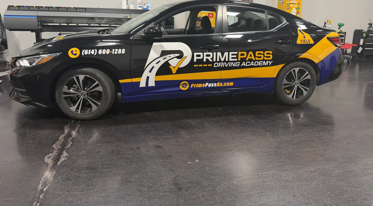 Driving school sedan with fleet graphics