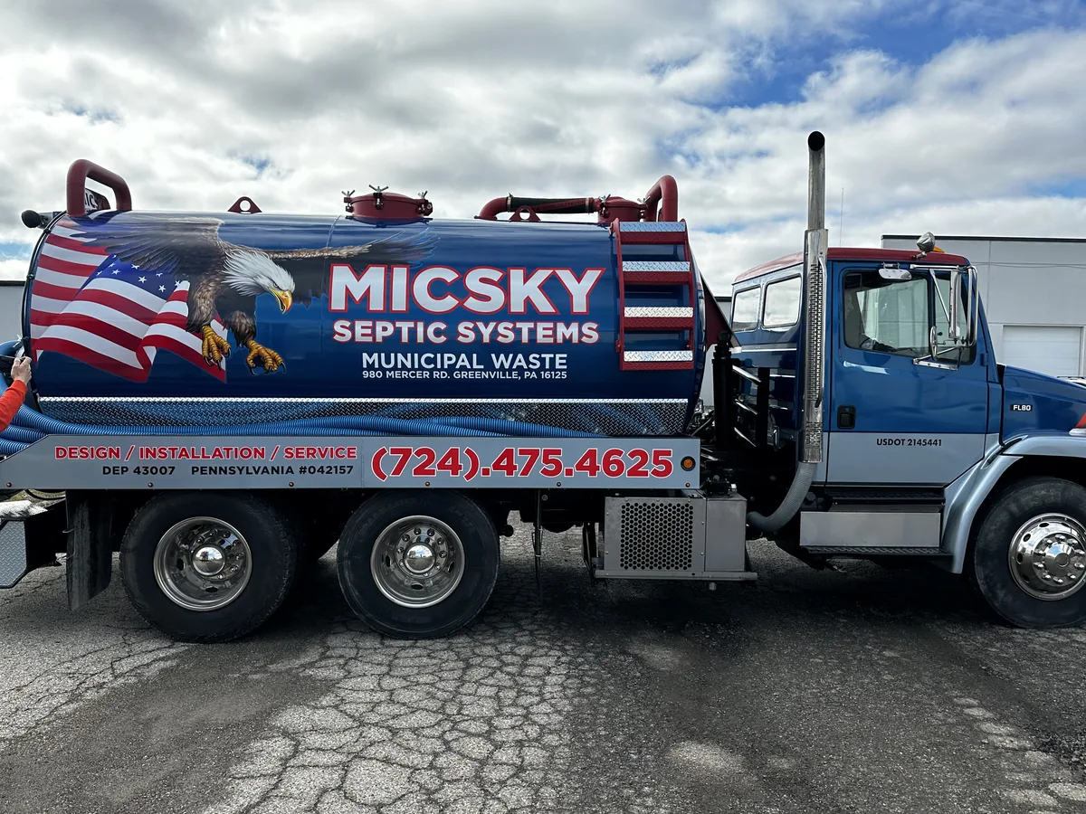 Septic tanker truck with flag graphics